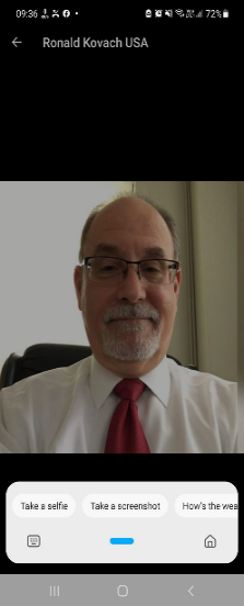 A person wearing glasses and a suit
Description automatically generated with low confidence